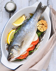 baked fish with herbs, vegetables and garlic