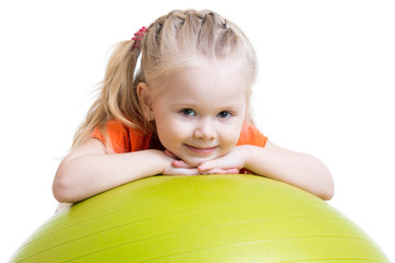 child girl doing fitness exercise with fitness ball