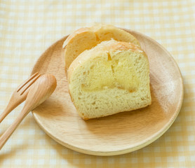 Butter cake sliced on wooden dish