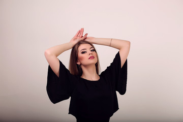 Fototapeta premium Portrait of beautiful face of an young woman with long brown hai