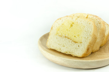 Butter bread sliced on wooden dish with white background isolate