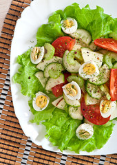 Salad of tomatoes, cucumbers and quail eggs