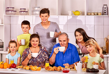 Big happy family have breakfast.
