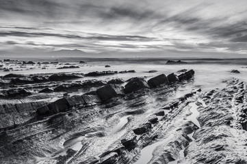 Barrika beach at sunset. Long exposure in the rocky shore