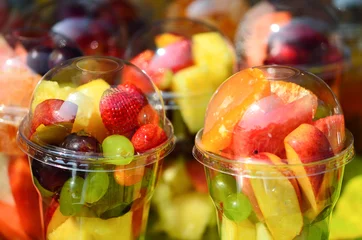 Zelfklevend Fotobehang Fruit Salad arranged in plastic cups © thongchuea
