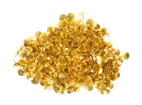 Gold Thumbtacks On A White Background