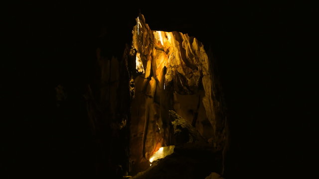 Movement of sun beam in dark cave, Lop Buri, Thailand.