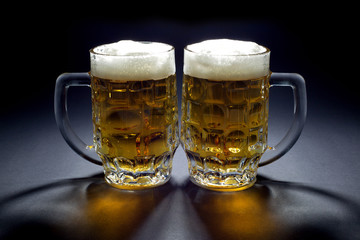 Pair of Cold Beer Mugs Waiting for Someone to Drink Them
