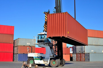 Crane lifting up container in yard, the Port of Tokyo, Japan