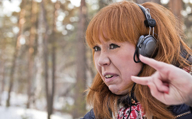 The girl with red hair depicts rocker.