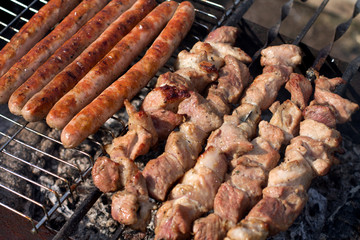 Meat slices in sauce on fire