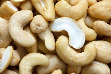 Detail of many cashew nuts from above. Abstract pattern.