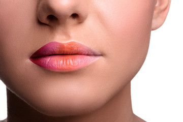 Close up lips shot of young woman posing, showing her tongue