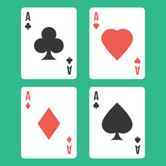 Four aces. Playing cards isolated on green background