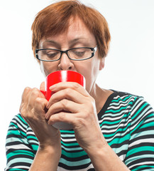 old woman drinking coffee (tea)