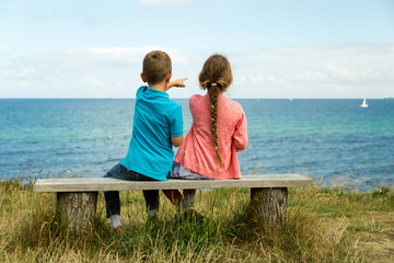 Kids overlooking the ocean