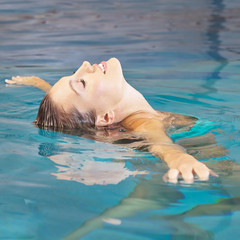 Woman doing water yoga for relaxation