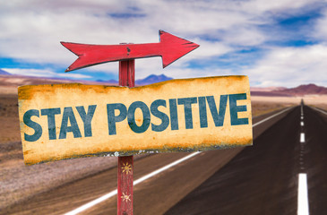 Stay Positive sign with road background