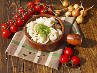 dumplings with meat on a wooden table