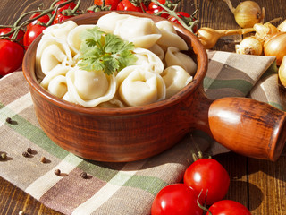 dumplings with meat on a wooden table