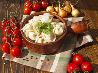 dumplings with meat on a wooden table