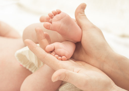 Baby feet in mother hands