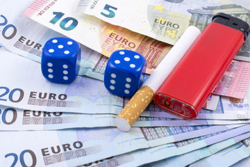 Dice, money, cigarette and lighter