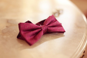Pink bowtie on table