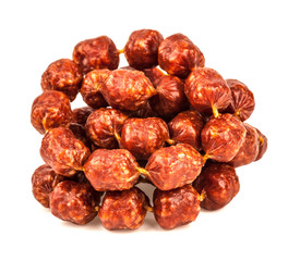 Mini sausages on white background