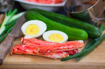 The ingredients to make the salad - crab, cucumber, egg, onion