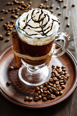 coffee with cinnamon and whipped cream close-up