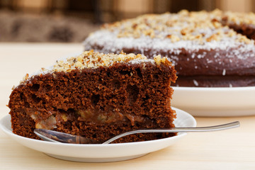 Piece of hocolate cake with walnut and peach