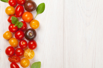 Naklejka na ściany i meble Colorful cherry tomatoes and basil