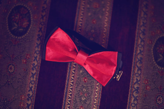 Red Bowtie On Striped Background