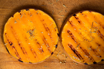 Grilled pumpkin slices with herbs