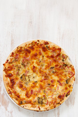 pizza on white wooden background