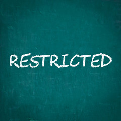 Obraz premium RESTRICTED written on chalkboard