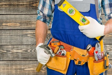 Handyman. Handyman with a tool belt. Isolated on white