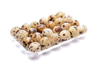 Quail eggs isolated on white background