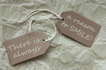 Two Beige Labels With Quote Always Reason Smile Paper Background