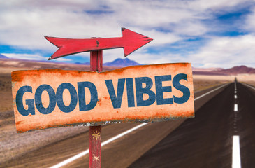 Good Vibes sign with road background