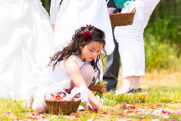 Wedding bridesmaids with flower petal basket