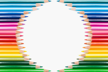 Fototapeta premium Colored pencils lined up in circular frame