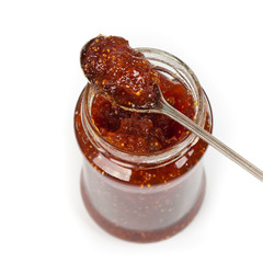 Fig Jam on white background. Macro. Selective focus.