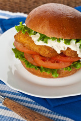 Breaded Fish burger. Selective focus.