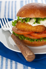 Breaded Fish burger. Selective focus.