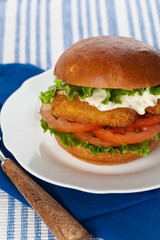 Breaded Fish burger. Selective focus.