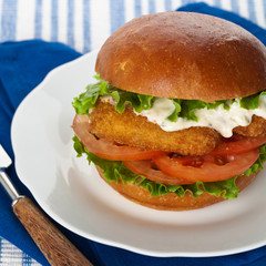 Breaded Fish burger. Selective focus.