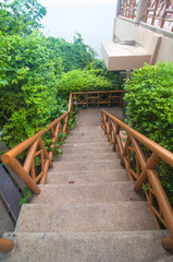 Stone staircase with wood hand rails