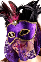 Portrait of a woman wearing a carnival mask